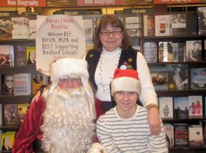 Santa, with James Robert White and BEF Book Fair organizer Linda White